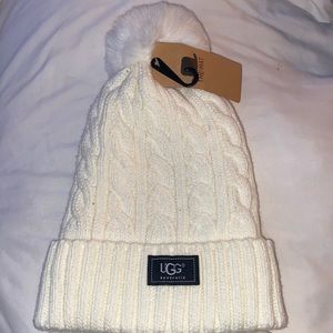 Never been worn White knitted puff ball hat.